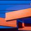 Rennbahn Spieltafel mit bunten orangeroten und blauen Spielfeldern aus Kunststoff.