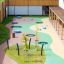 Rundes trampolin (80 cm) auf modernem Spielplatz mit elastischem Gummibelag