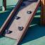 Schloss Spielhaus mit Kletterwand und Rutsche für Kinder auf Spielplatz