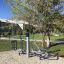 Set 8, Aussenfitnessgerät mit vier Sitzplätzen und Pedalantrieb für Spielplatz oder Park.